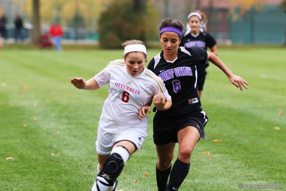 	Freshman forward Polly Sellers pushes past the Mount Union defender in pursuit of the ball. 