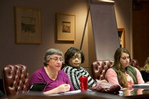 Members of the Curriculum Committee discuss changes.