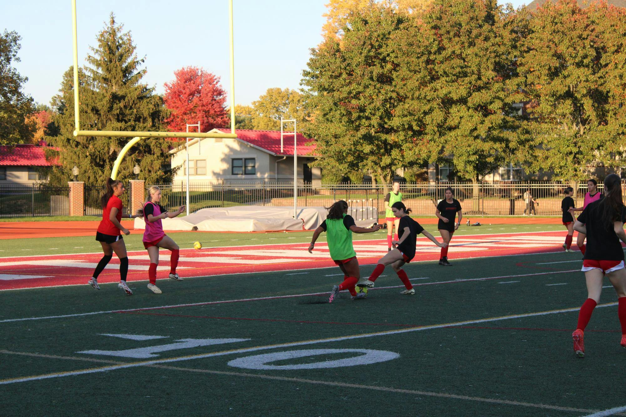 A women's soccer team playing a practice game