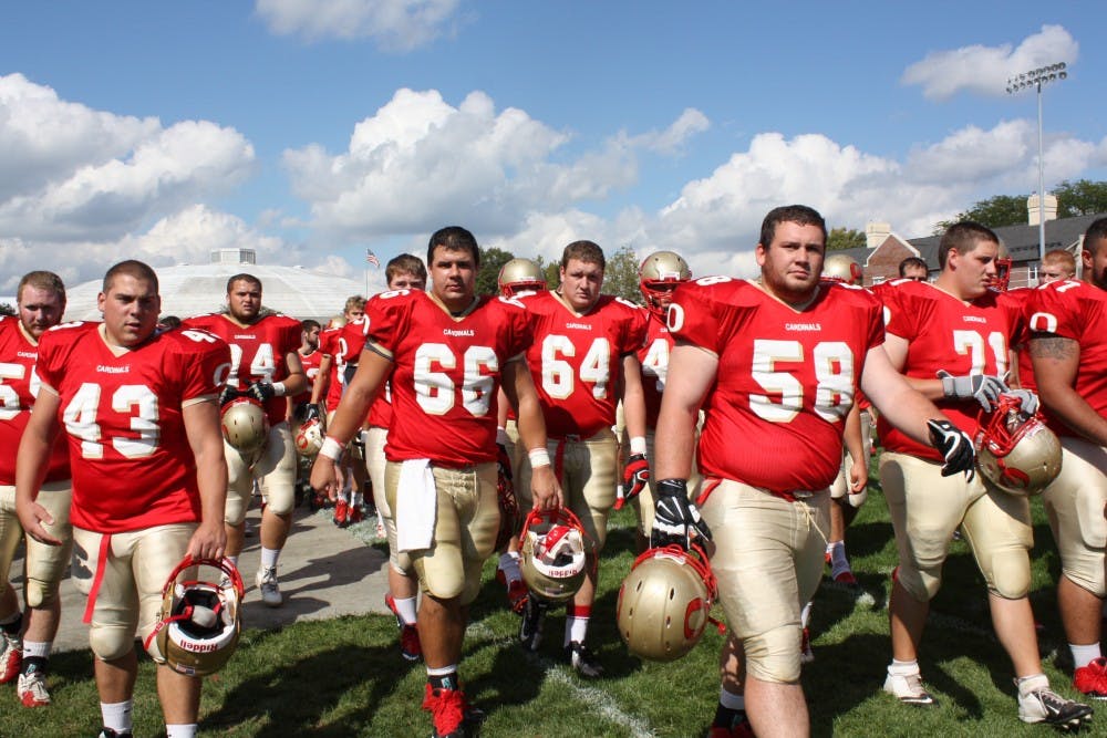 	<p>Otterbein Football players head off for halftime, ready for the win against Wilmington.</p>