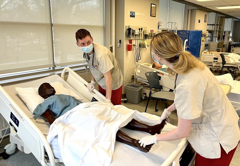Otterbein nursing students practice on a dummy