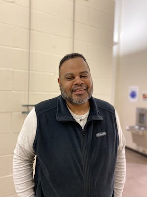 Professor Eric Jones stands in the Art & Communication building without a mask on