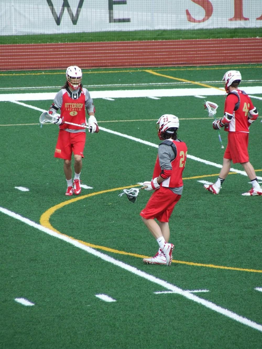 <p>The Otterbein men's lacrosse team practicing at Memorial field. The team and its players have been nominated for seven Cardy Awards this season.</p>