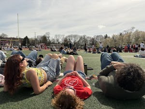Otterbein Students Lay on the Football Field During the Totality Party