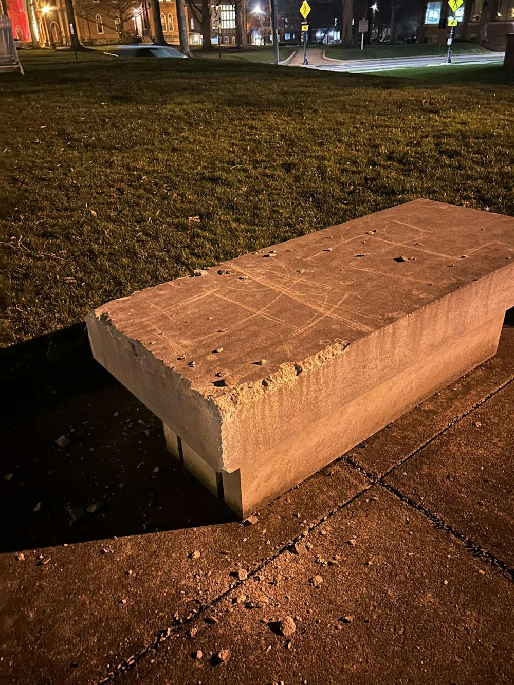Stone bench outside found vandalized with racially motivated and antisemitic hate speech. Photo given to T&C Media from Greyson Thagard.
