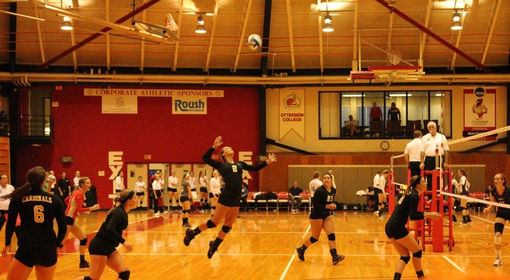 	<p>Freshman Lauren Beitel launches into the air after the ball during the recent Cardinal volleyball game against Hope College. The Cards lost the match in three sets. </p>