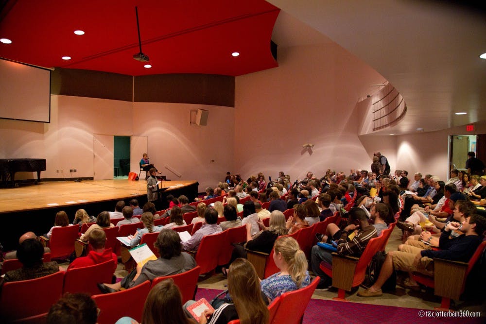 <p>Otterbein president Kathy Krendl begins the senate meeting by asking those present for announcements</p>