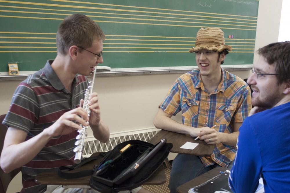 	<p>Students working together during a composition class.</p>