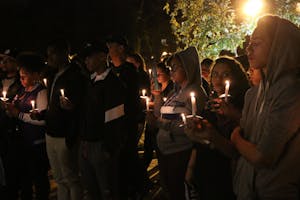 Students light candles in memory of Tyre King, the 13-year-old boy shot by police in Columbus Sept. 14.