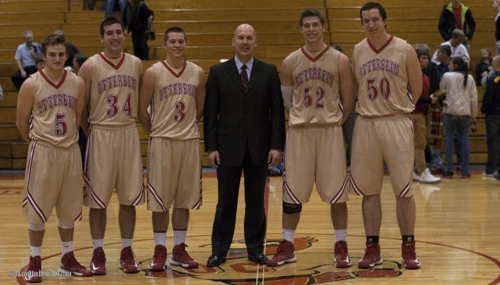 	Coach Todd Adrian and his five seniors at the conclusion of the John Carroll game. The team had a tough loss, 78-73.