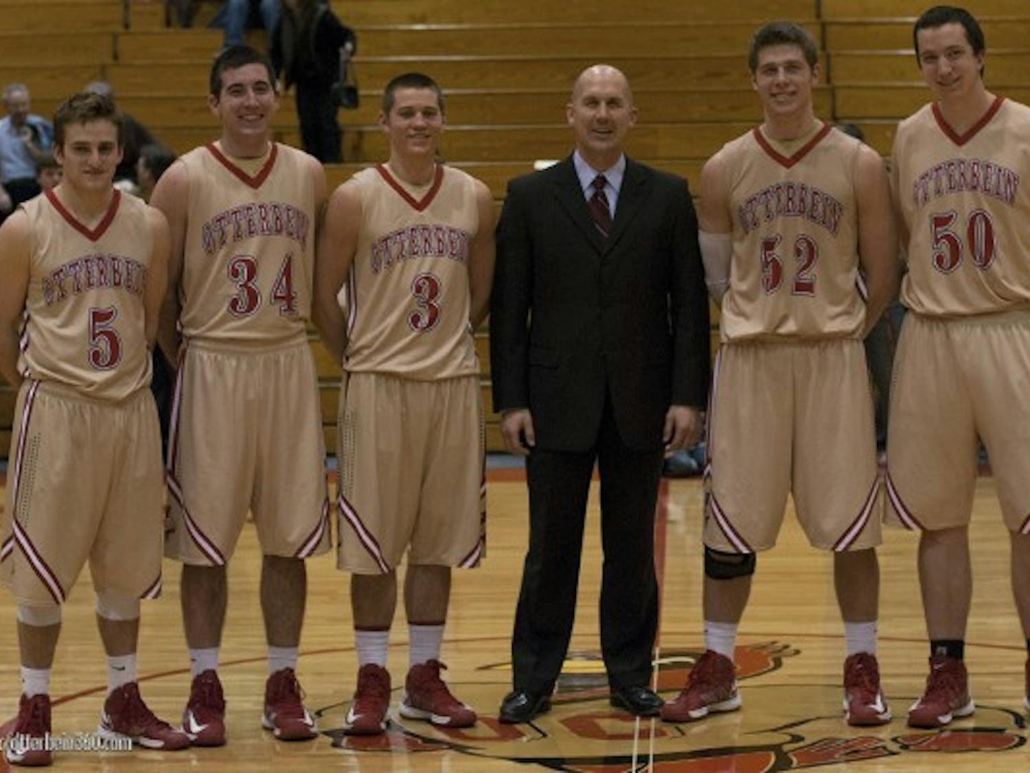 	Coach Todd Adrian and his five seniors at the conclusion of the John Carroll game. The team had a tough loss, 78-73.