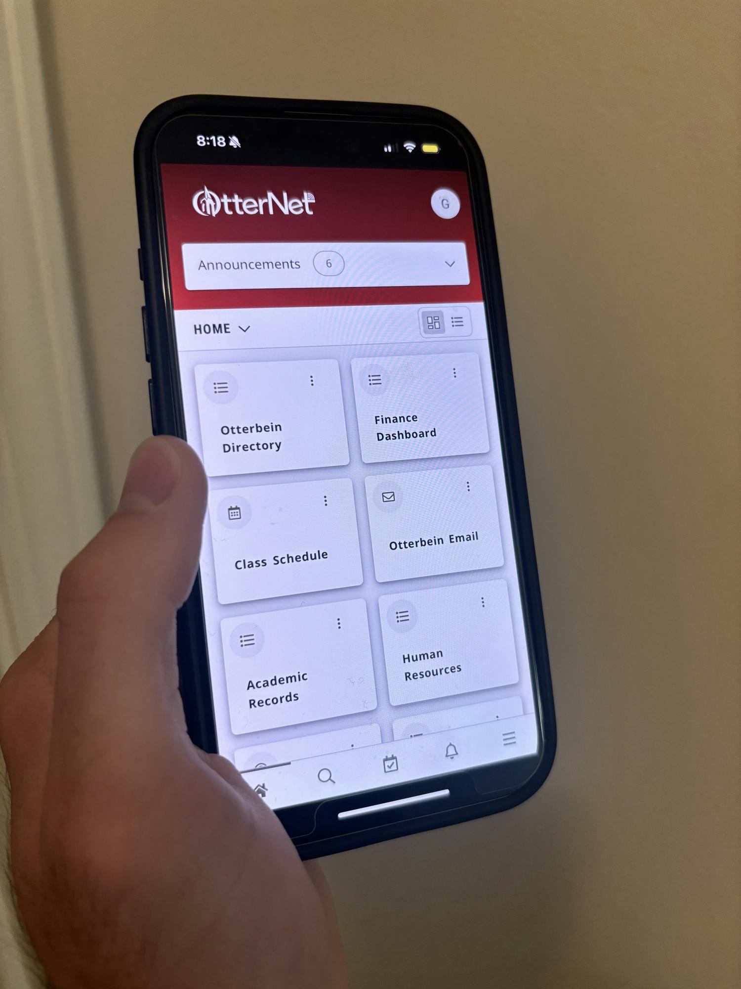 A photo of the OtterNet user interface on a mobile phone.