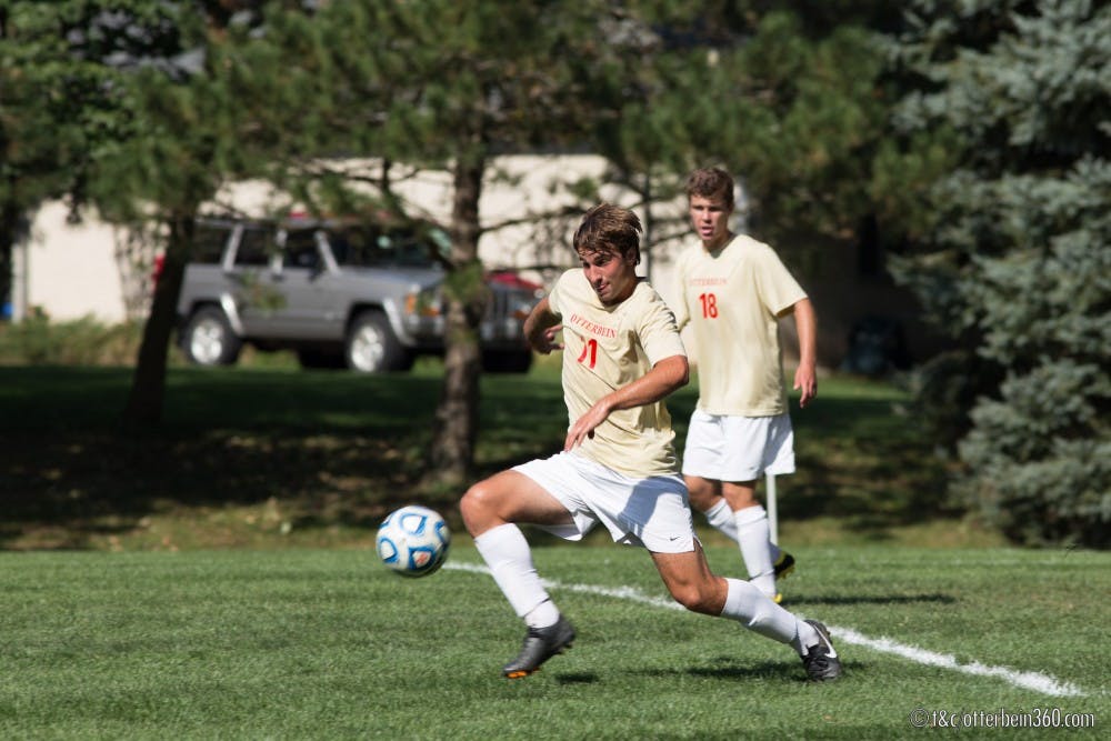 	<p>Junior midfielder Conor Holland clears the ball from the Otterbein defense on a corner kick. </p>