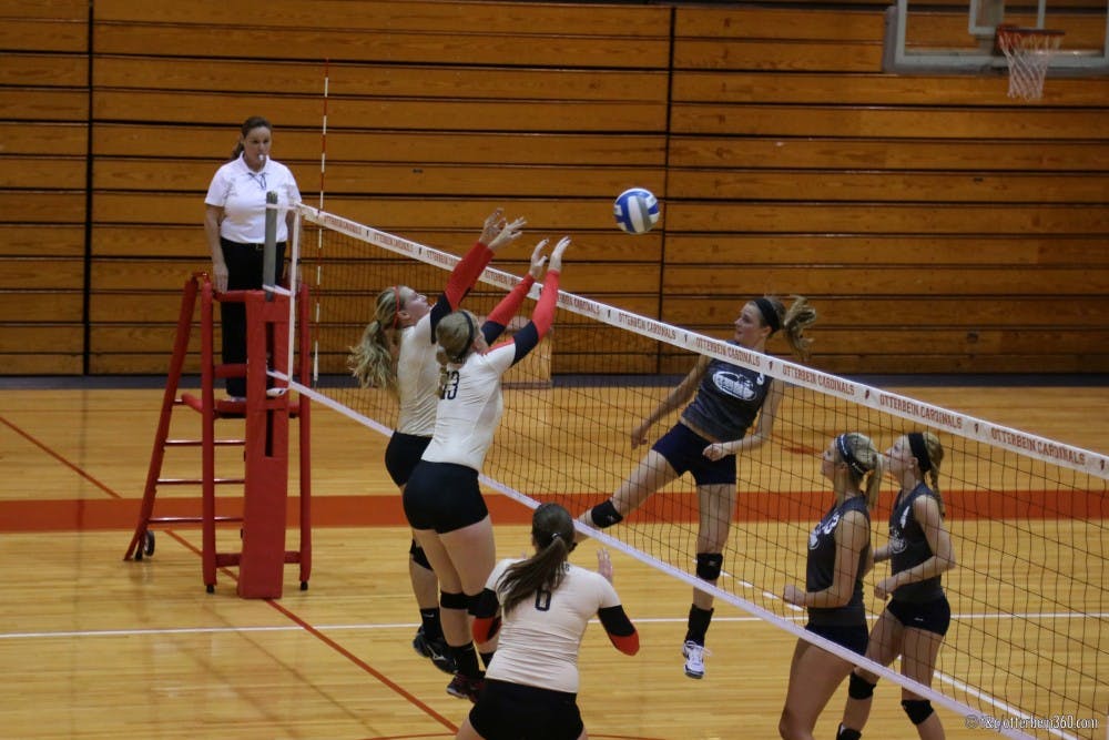 	<p>Otterbein Cardinals Maddy Shelley (2) and Kim Barker (13) team up for a block. </p>
