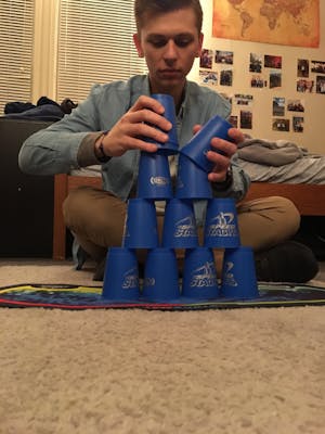 Michael Anderson stacks cups