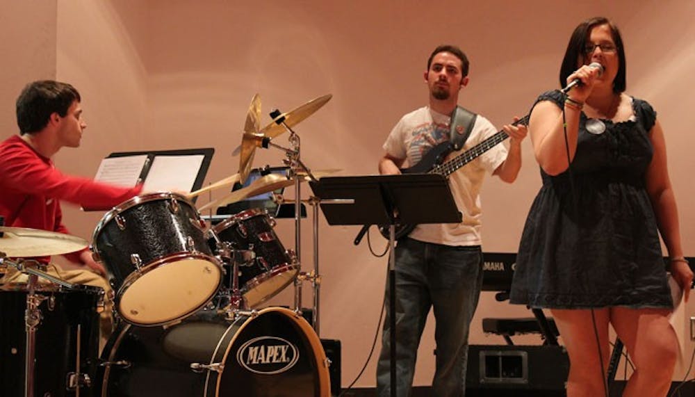 	<p>(From left to right): On drum, Alex Hayes; on bass, Paul Baker; singing, Tasha Thompson.</p>