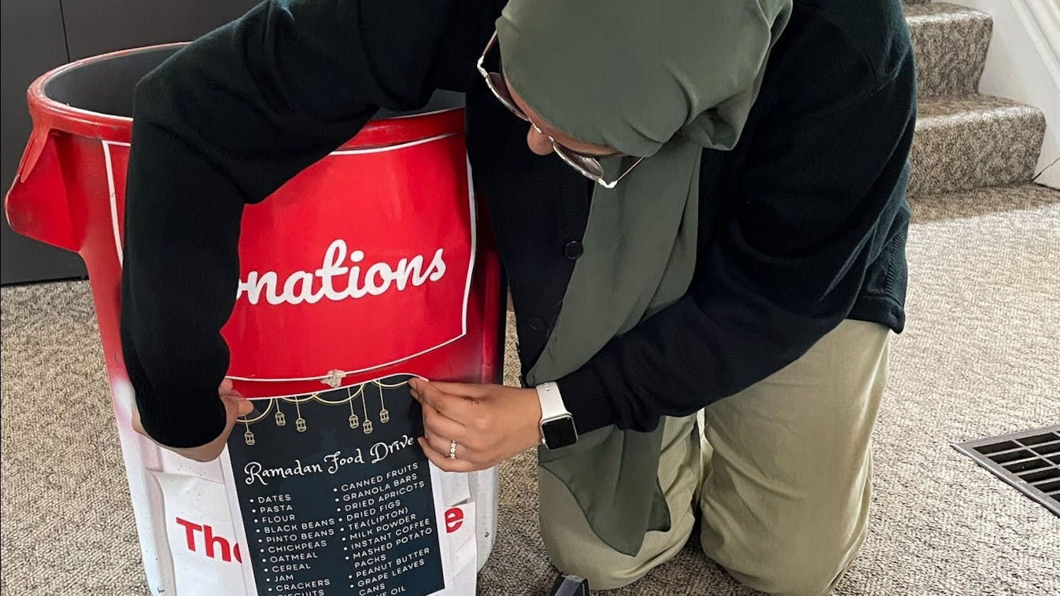 Yasmeen Khafagy prepares a donation bin for the Ramadan Food Drive