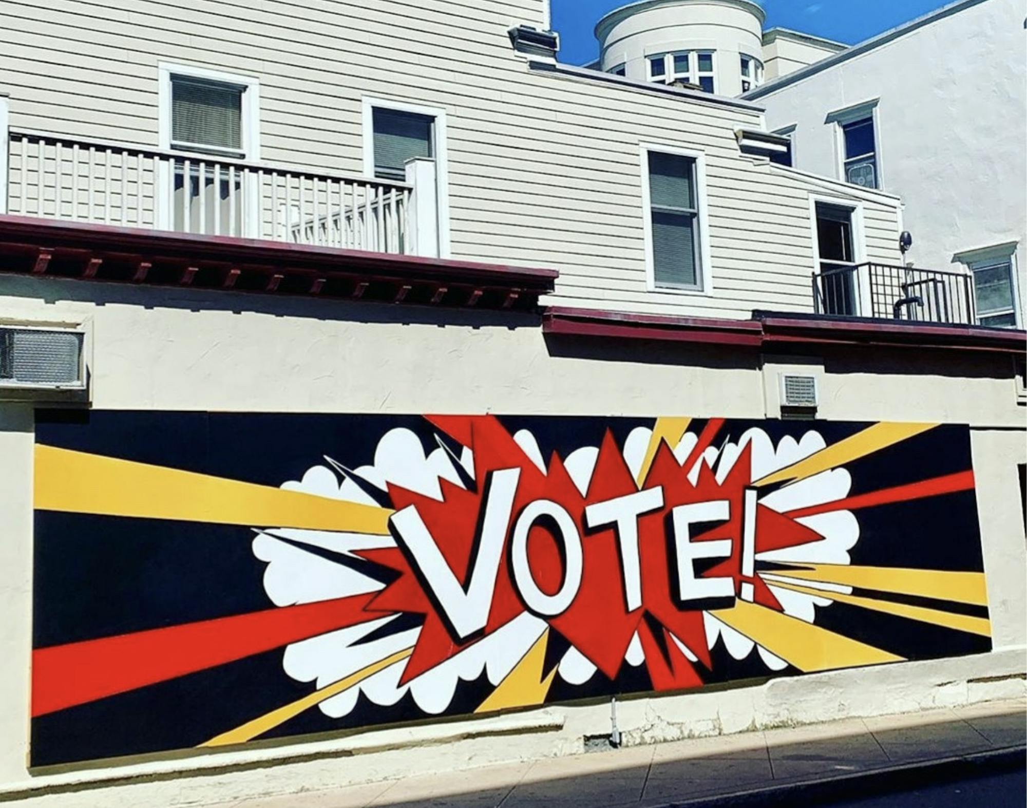 A mural that displays "vote." 