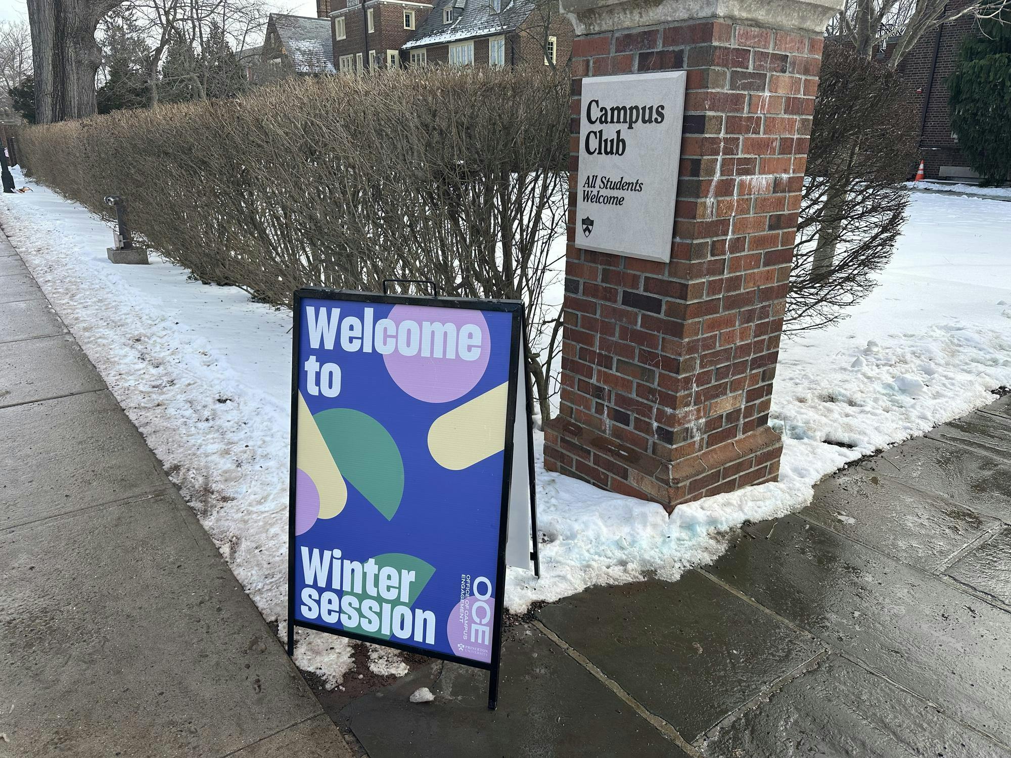 A sign reading "Wecome to Wintersession" stands in front of Campus Club.