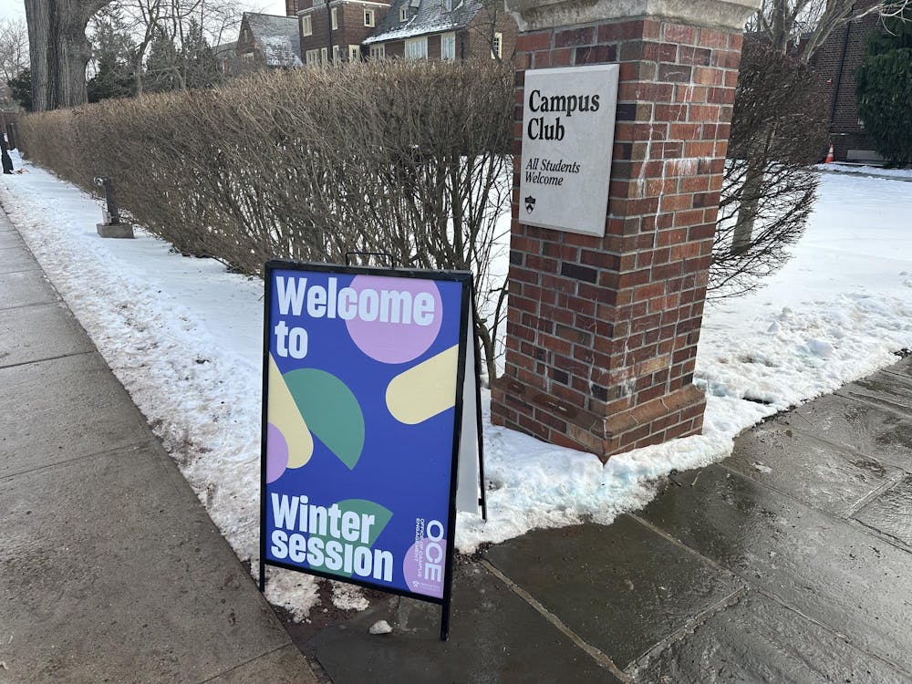 A sign reading "Wecome to Wintersession" stands in front of Campus Club.