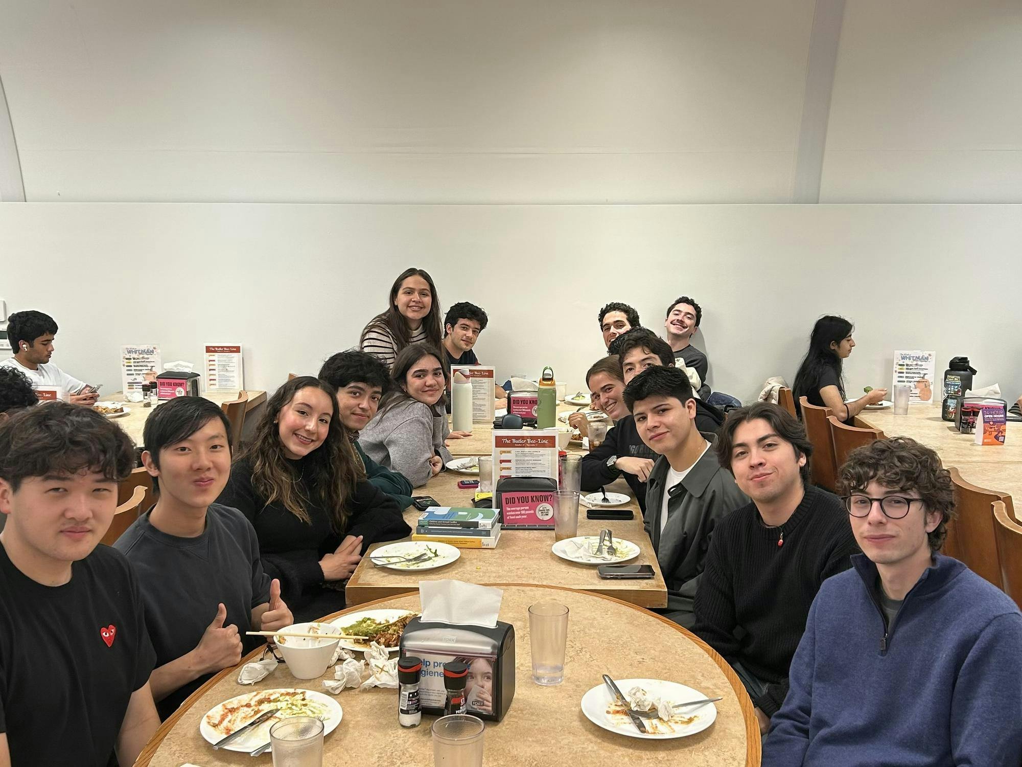 People sit at a long table