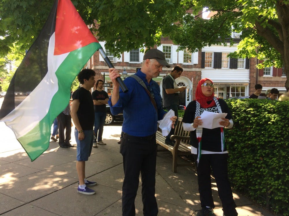 Princeton Theological Seminary professor Mark Taylor waving Palestinian flag,  Amal Awad reading the 62 names