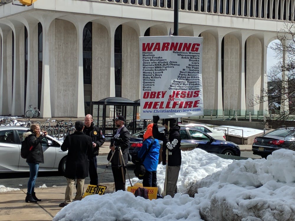 Public Safety officers confront protesters for upsetting students.