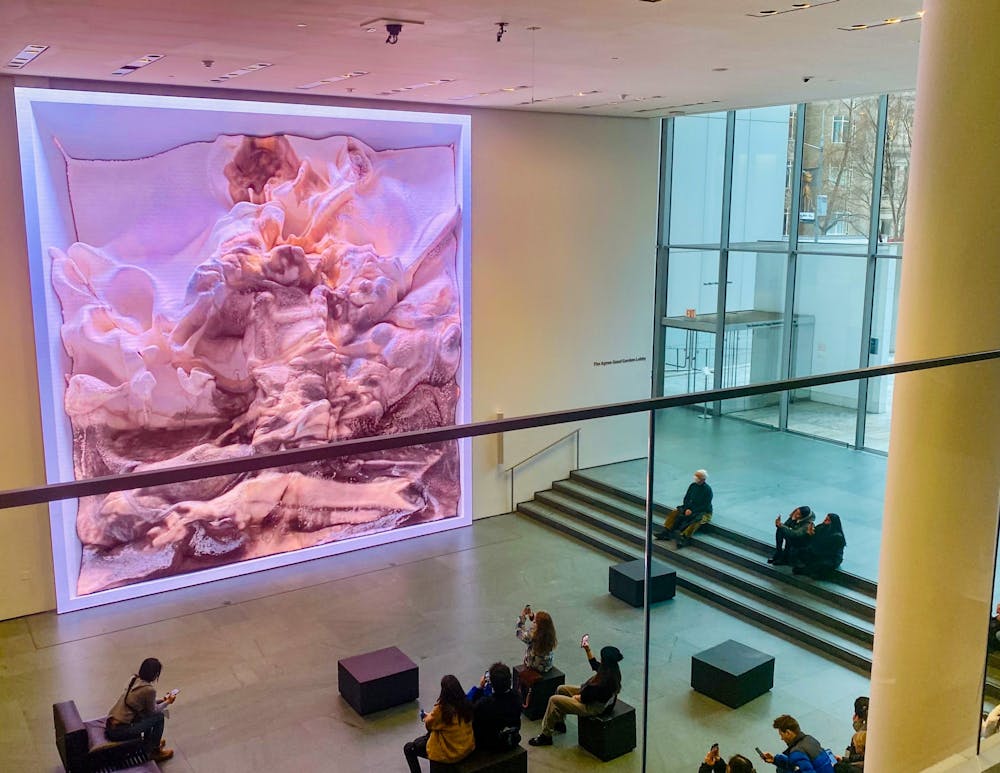 <h5>Exploring the intersection of art and technology at the Museum of Modern Art's first-floor exhibit featuring AI-generated artwork.</h5>
<h6>Guanyi Cao / The Daily Princetonian</h6>
<h5><br></h5>