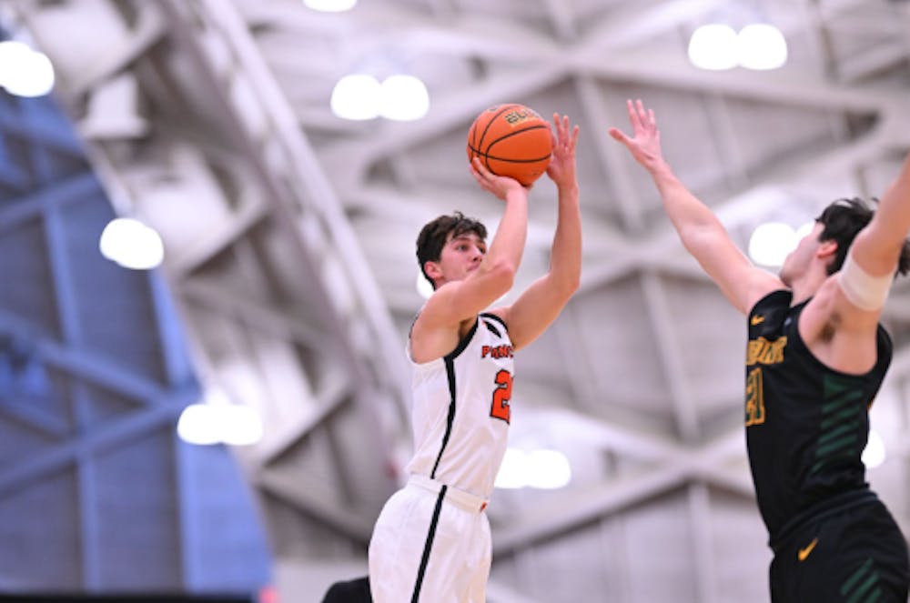 Princeton guard Jack Stanton shooting the ball.