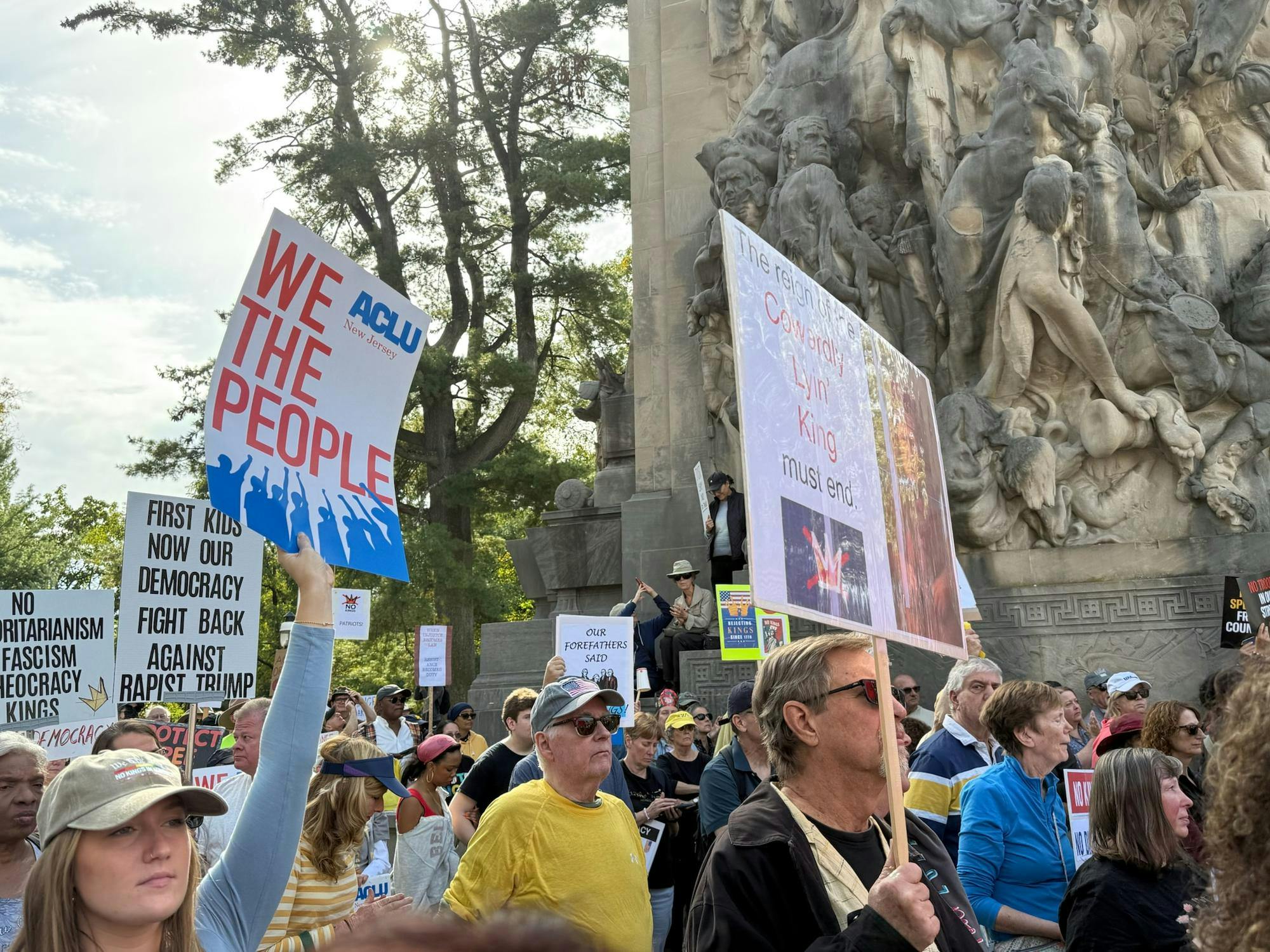 Protesters gather on a sunny day. 