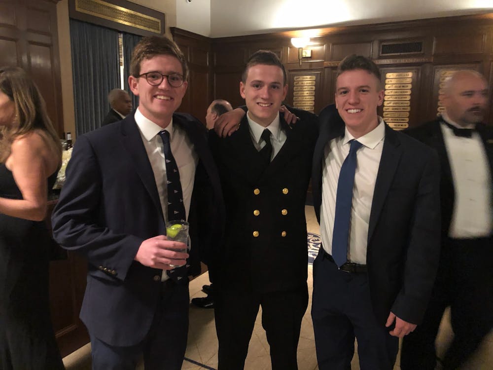 <p>Midshipman Fourth Ensign Alex Bound ‘23 (center) and Cadet Sergeant Jack Bound ‘22 (right) with their elder brother, Harry Bound ‘21.&nbsp;</p>
<p>Photo credit: Jack Bound.&nbsp;</p>