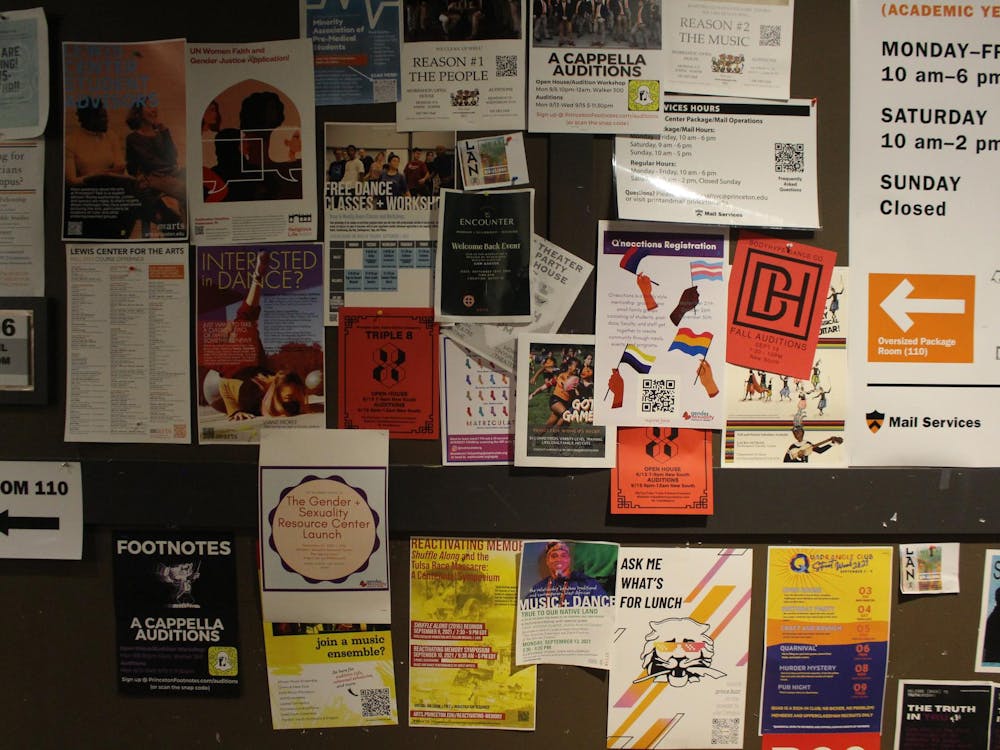 Wall with various posters advertising different student activities.