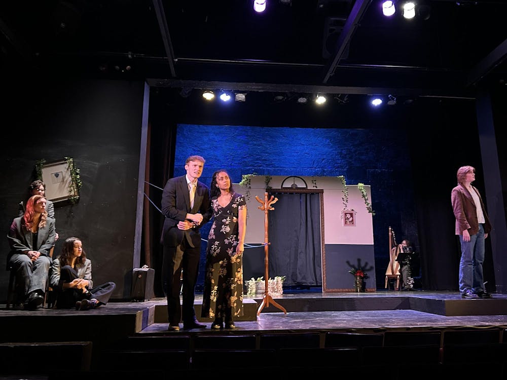 A scene with Eurydice and her father standing next to each other. 