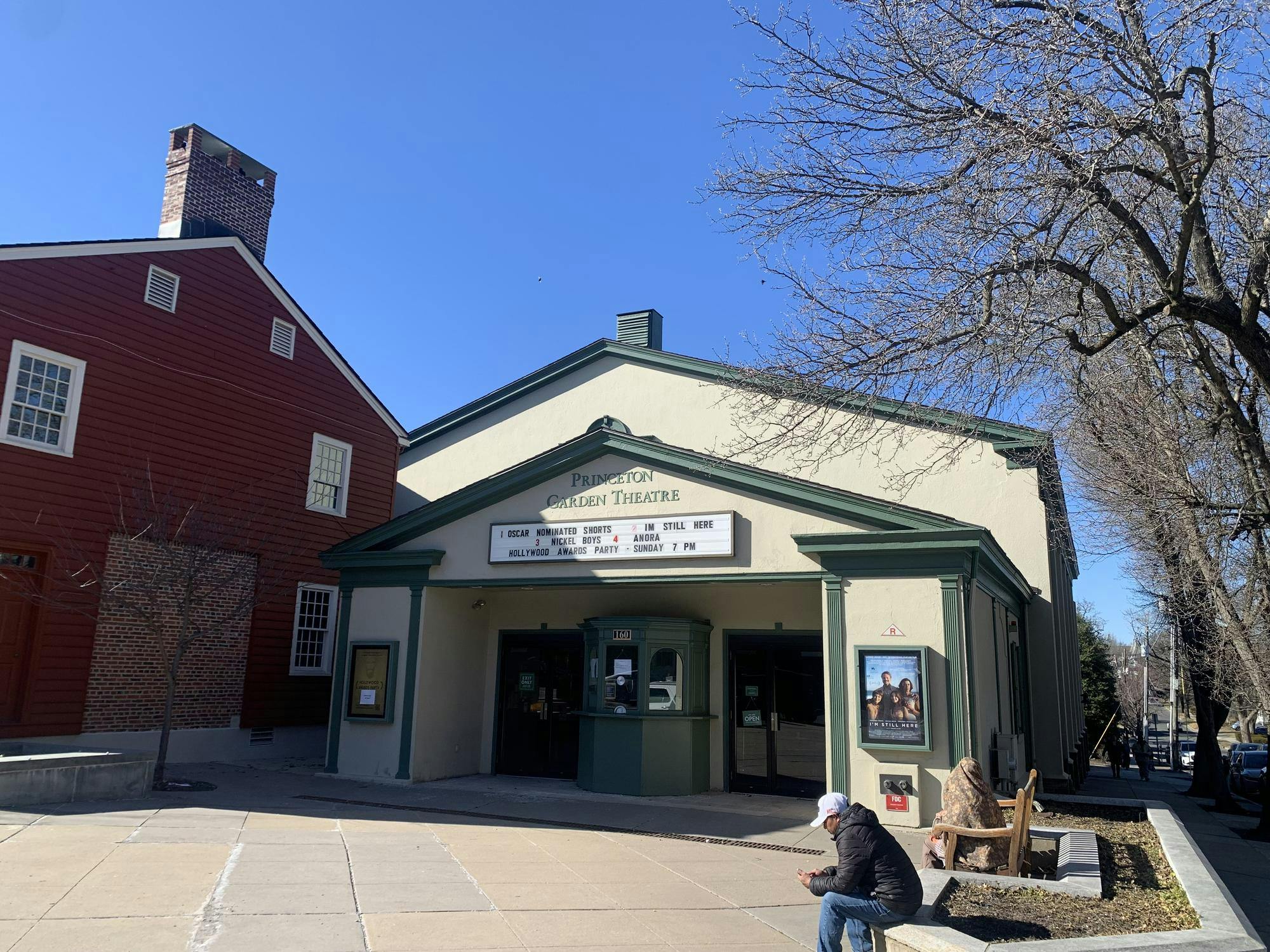Cream colored building with green trim.  Green letters spell out “Princeton Garden Theatre.”