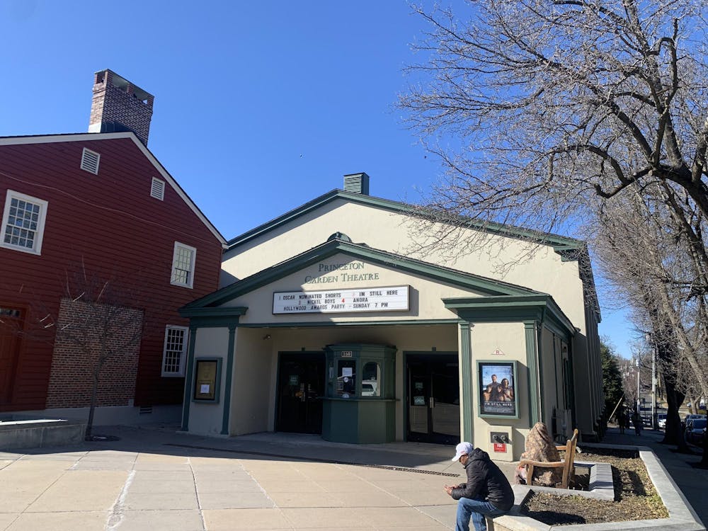 Cream colored building with green trim.  Green letters spell out “Princeton Garden Theatre.”