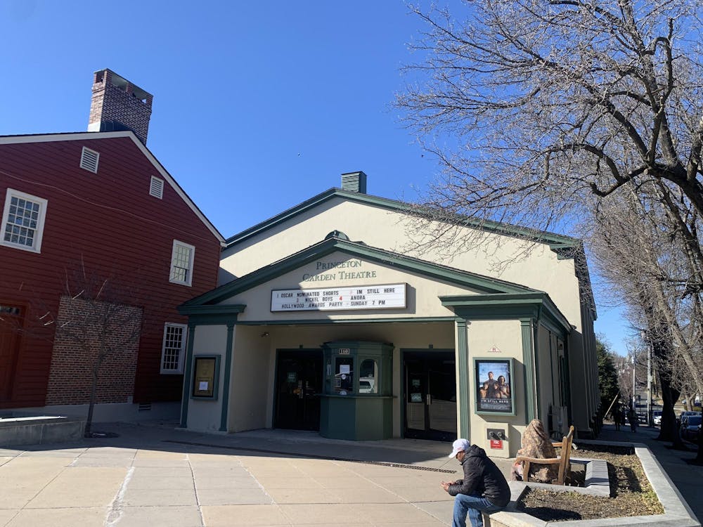 Cream colored building with green trim. Green letters spell out “Princeton Garden Theatre.”