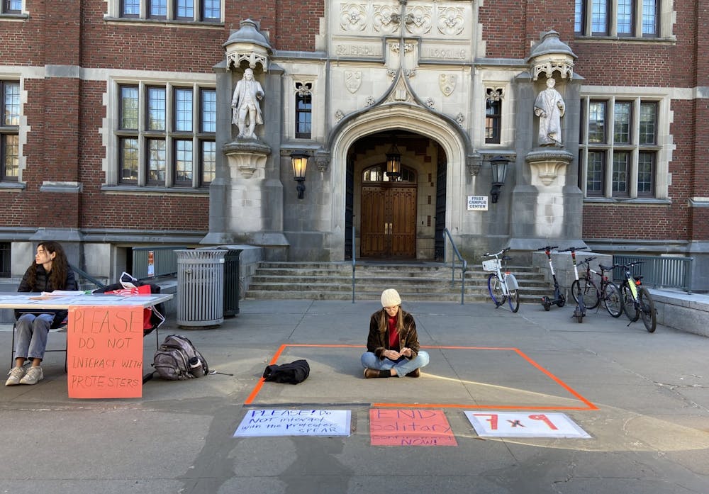 <h5>A protestor outside Frist Campus Center on Wednesday, 11/9.</h5>
<h6>Michelle Miao / The Daily Princetonian</h6>