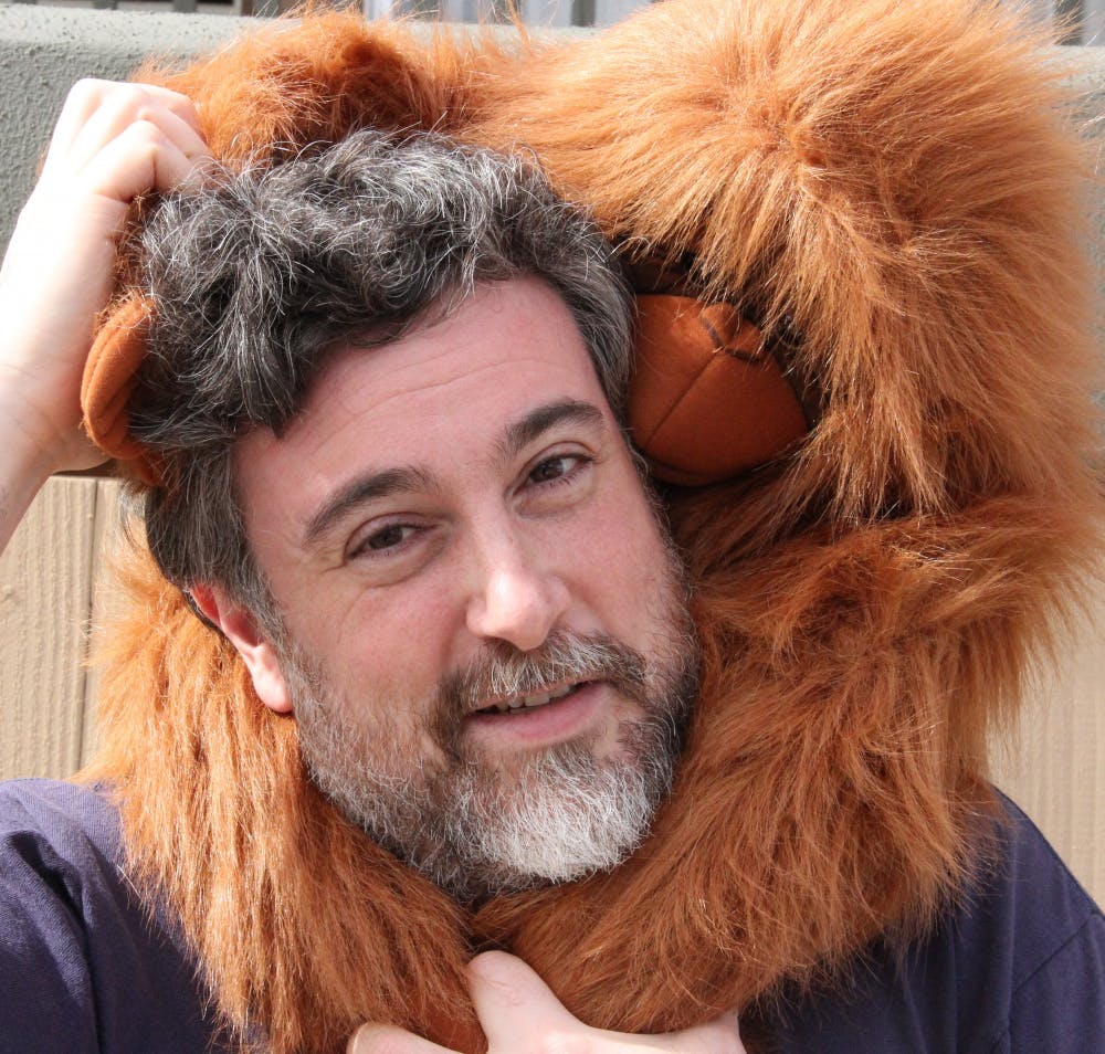 Professor Graziano and his orangutan puppet Kevin. Courtesy of Michael Graziano.