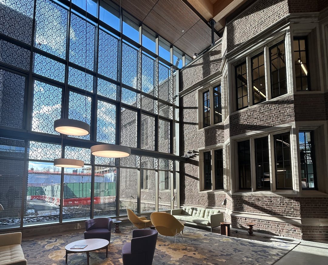 A picture taken from the inside of a building with a mix of old and modern looks.