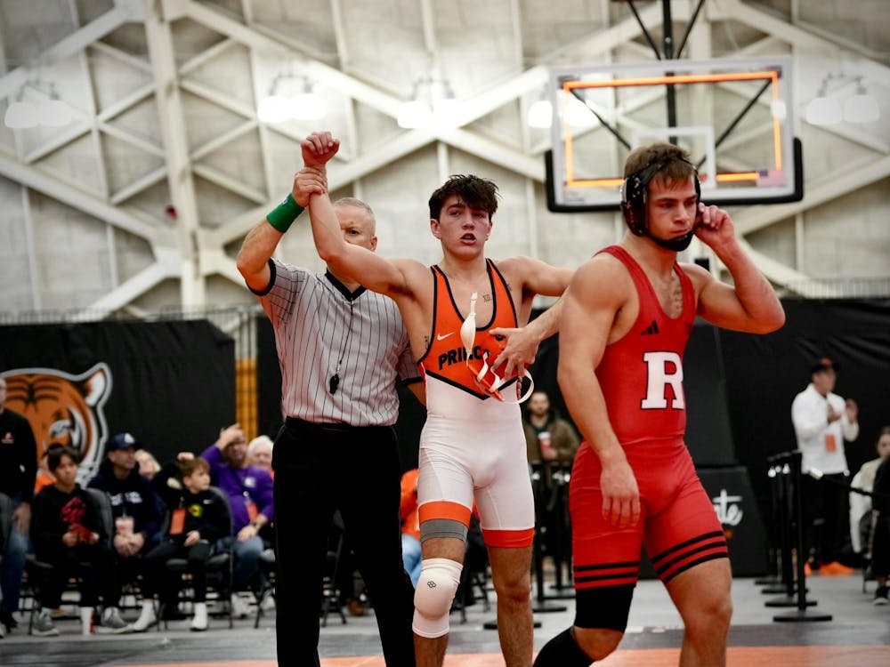 Princeton wrestler raises his hand in victory