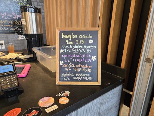 Menu written in colorful letters on small chalkboard. 