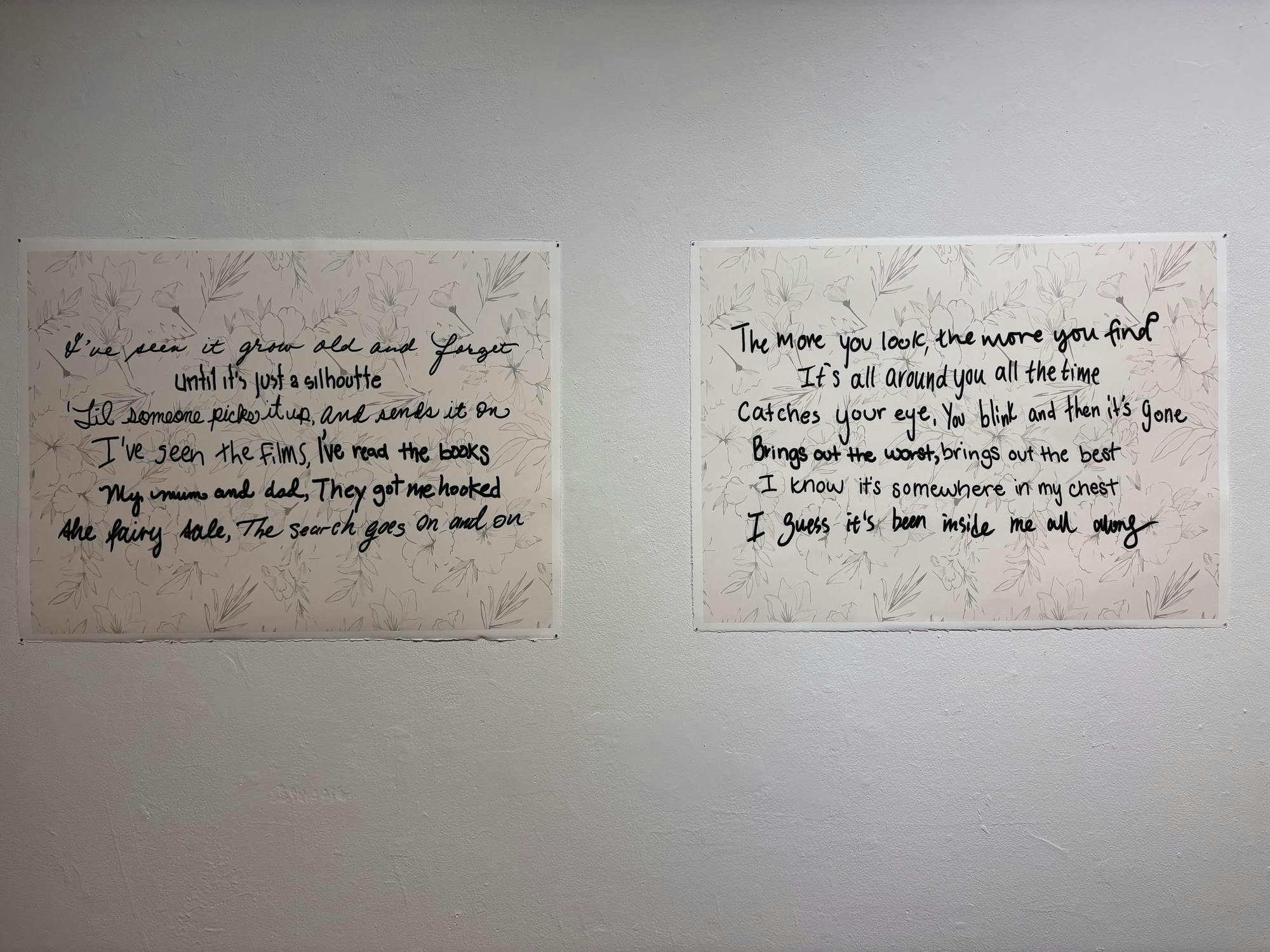 Two posters are side by side on a white wall. Each poster has a gray floral background with black text in a myriad of fonts.