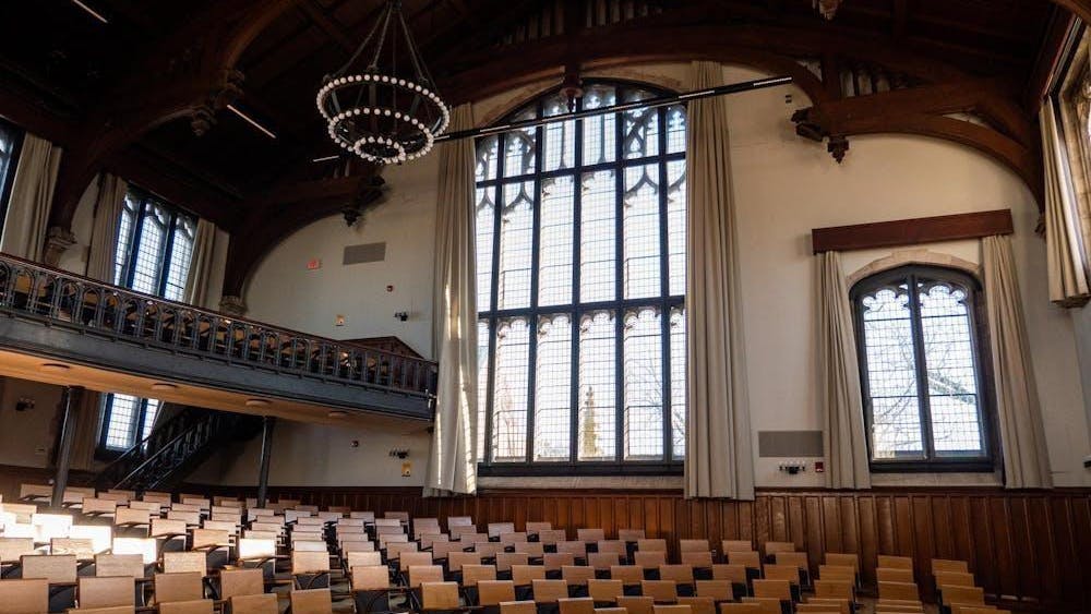 A large lecture hall with many chairs.