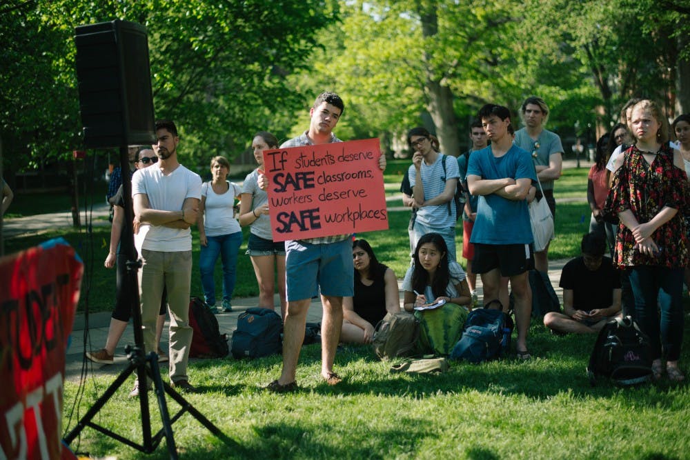 Students displaying handmade signs during YDS town hall on May 9, 2018.