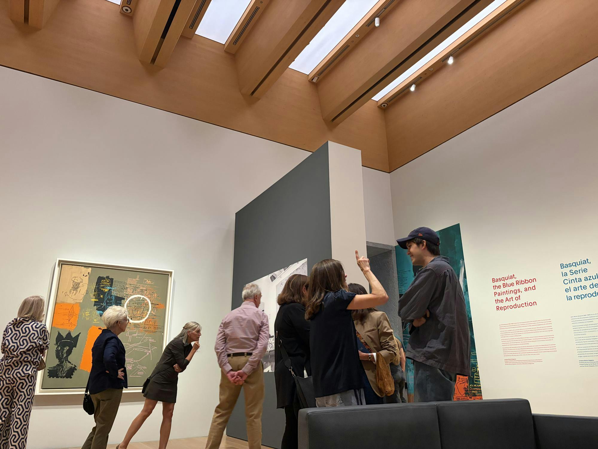 Visitors wander through the Princeton University Art Museum's Basquiat exhibition.