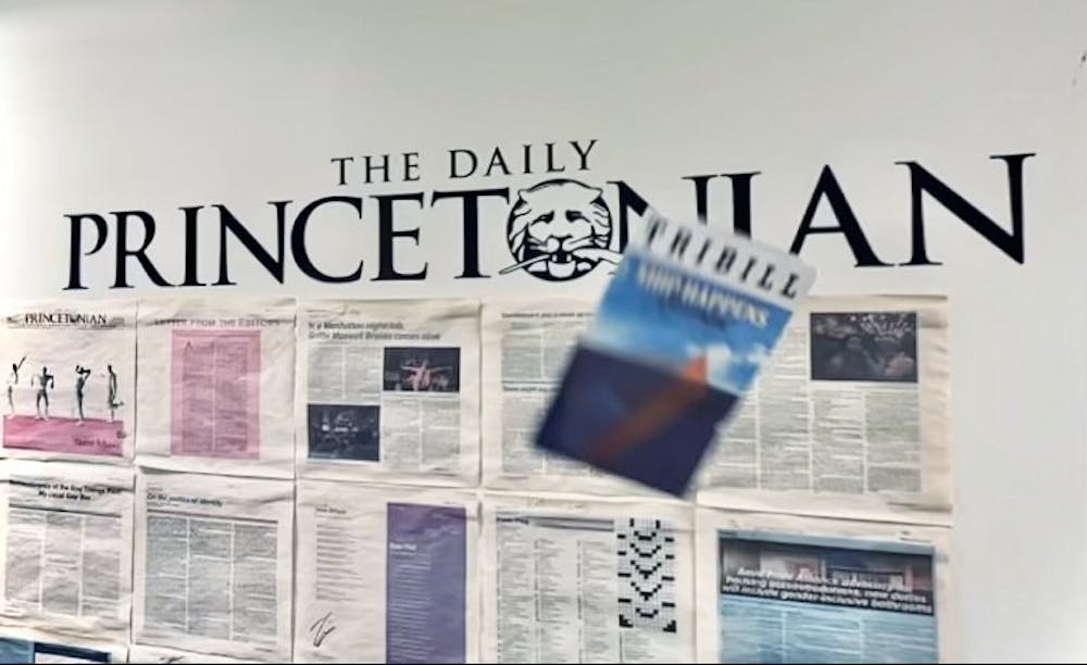 Triangle Playbill, also known as “Tribill,” flies through the air in front of a “Daily Princetonian” sign.