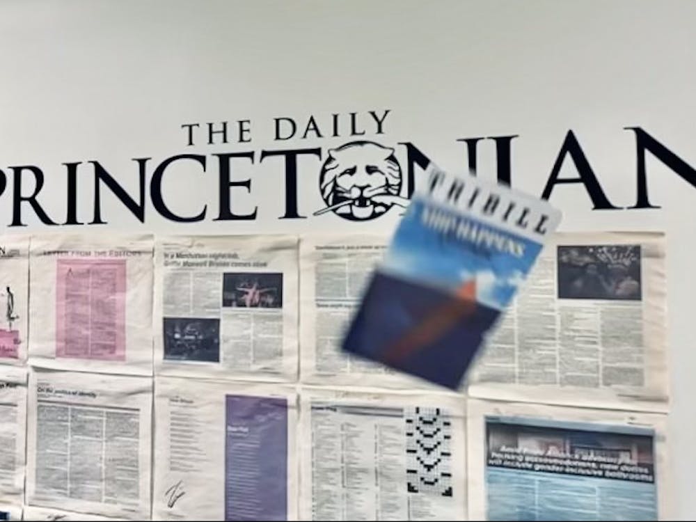 Triangle Playbill, also known as “Tribill,” flies through the air in front of a “Daily Princetonian” sign.