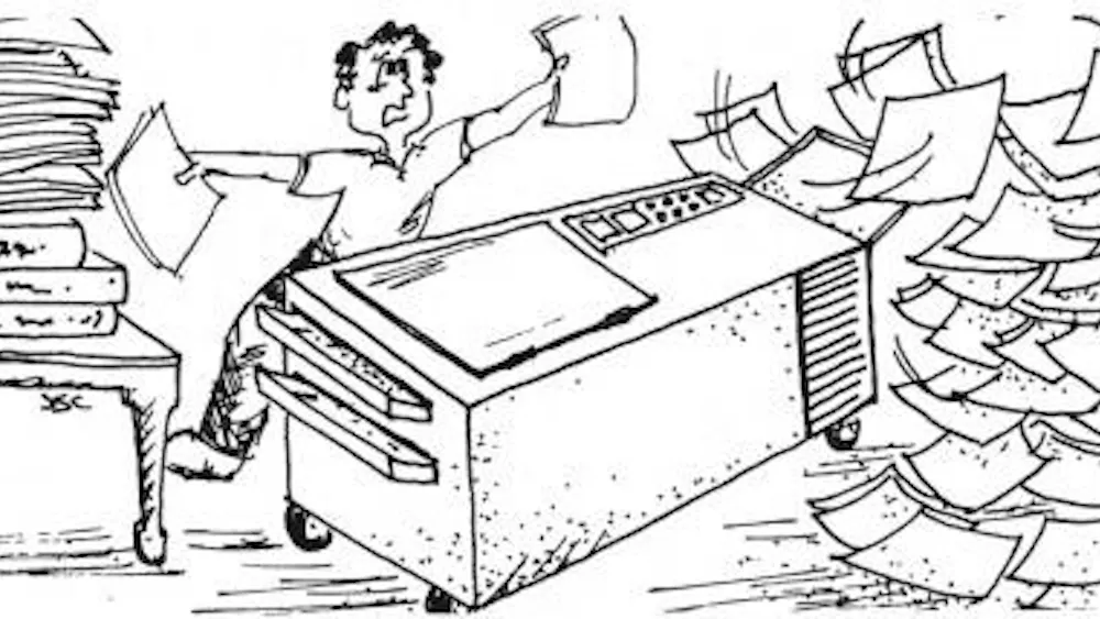 Black and white cartoon of a man struggling to contain papers flying around a photocopier.