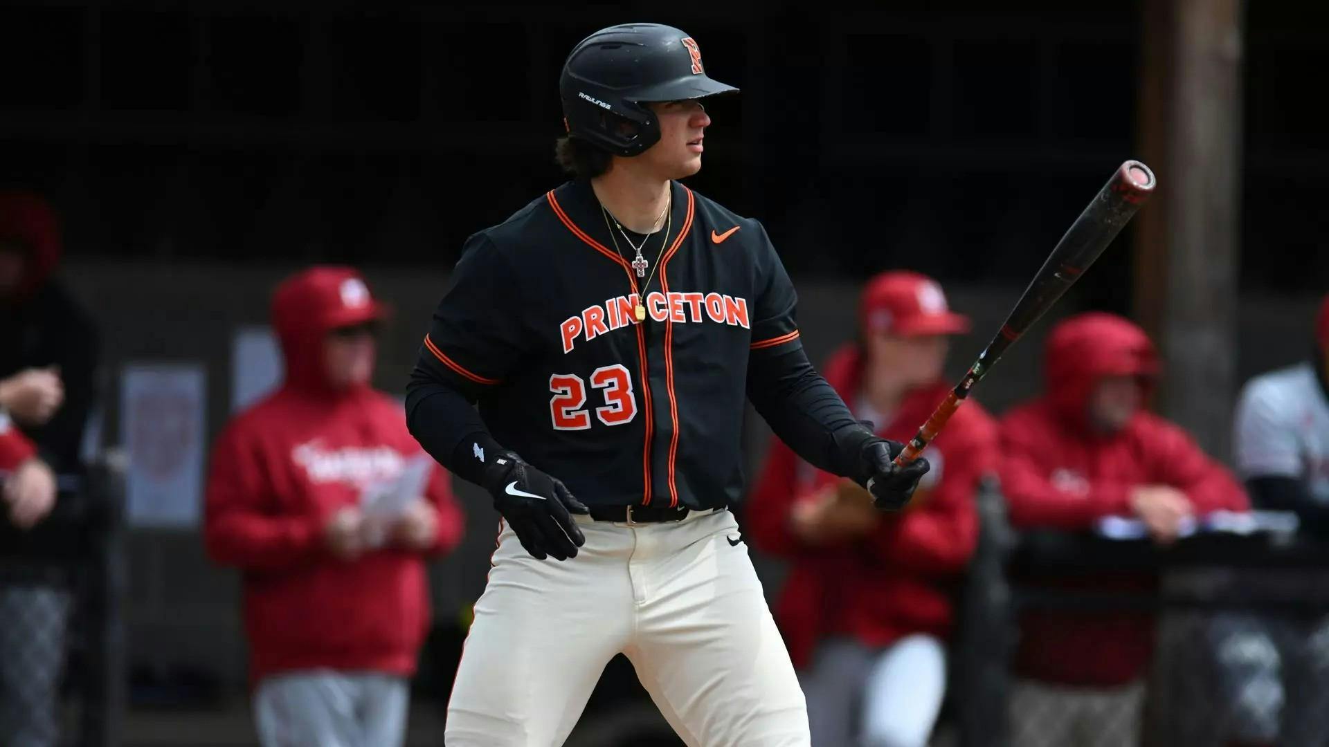 A man steps up to the plate on a baseball field.