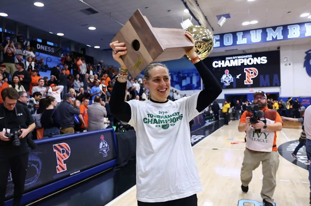 <h5>Berube hoisting the 2024 Ivy Mandess title inside Levien Gymnasium.</h5><h6>Photo courtesy of<a href="https://goprincetontigers.com/sports/womens-basketball" rel="noopener noreferrer" target="_blank"> Princeton Athletics.&nbsp;</a></h6>